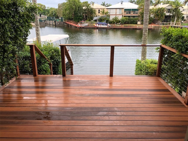 wooden deck with a water view