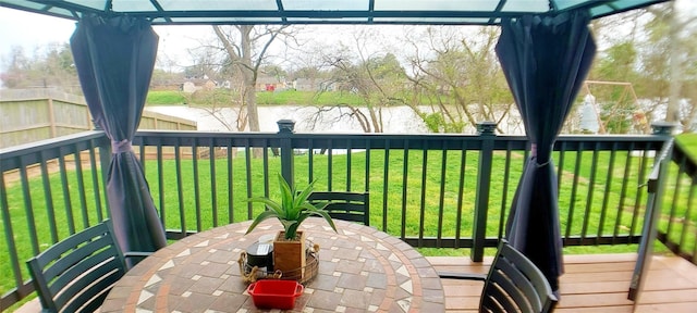 exterior space featuring a water view and a yard