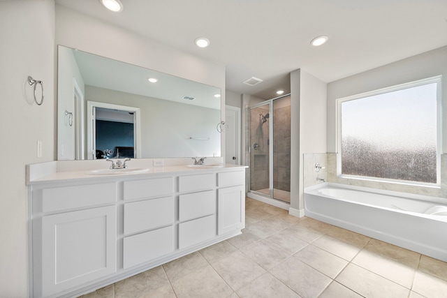 bathroom featuring separate shower and tub, tile patterned flooring, and vanity