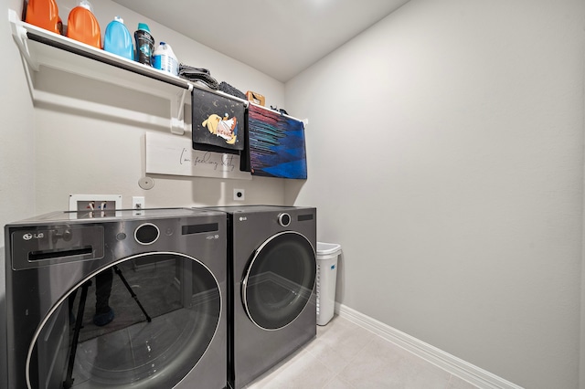 clothes washing area featuring washing machine and clothes dryer