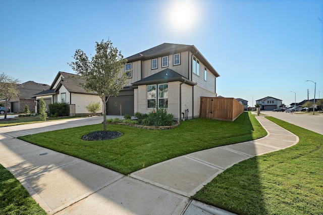 view of front facade with a garage and a front yard