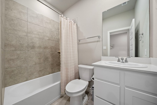 full bathroom with shower / tub combo, vanity, and toilet