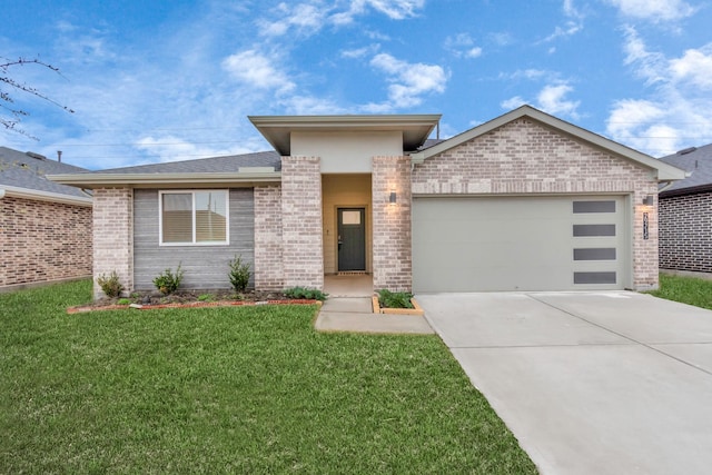 view of front of property with a front yard and a garage