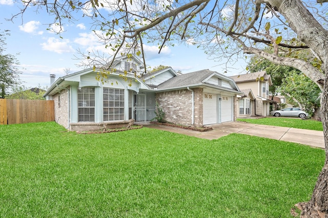 view of front of house featuring a front yard and a garage