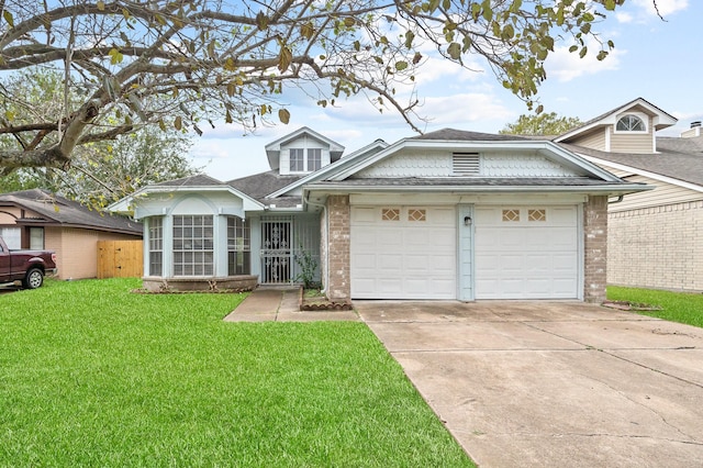 view of front of home with a garage and a front lawn