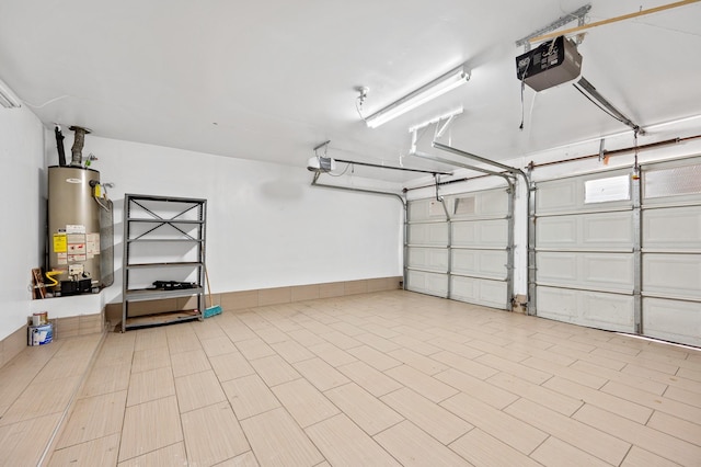 garage with water heater and a garage door opener