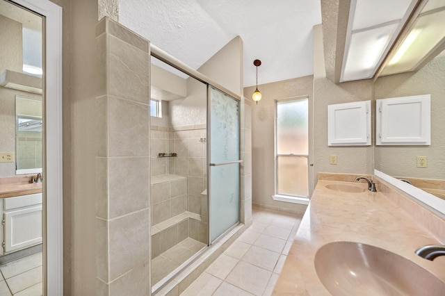 bathroom featuring tile patterned flooring, vanity, and an enclosed shower