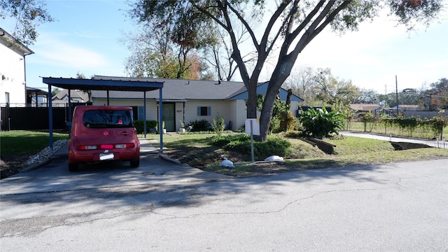 view of front of property with a carport