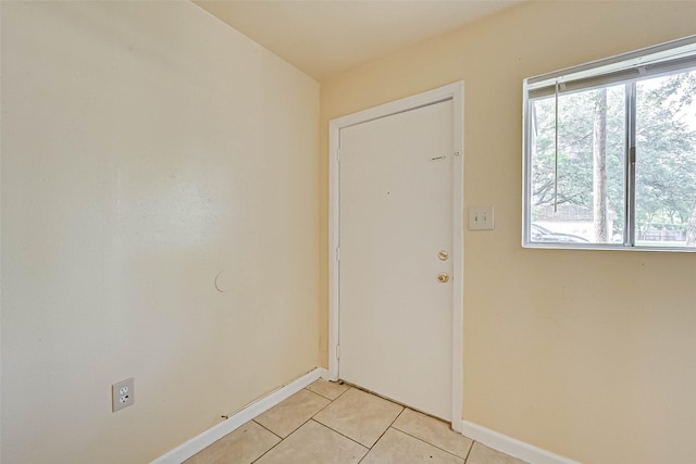 doorway featuring light tile patterned floors