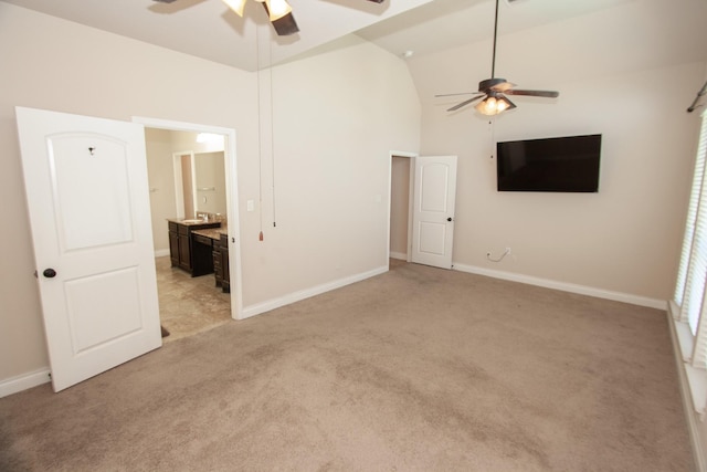 interior space with ceiling fan and high vaulted ceiling