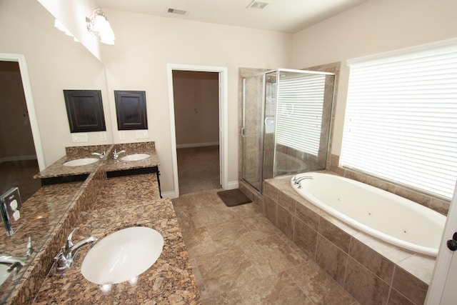 bathroom with plus walk in shower and vanity