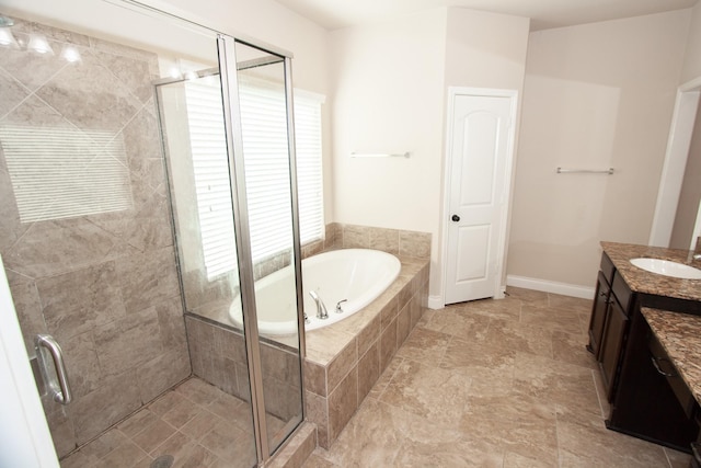 bathroom with plus walk in shower and vanity