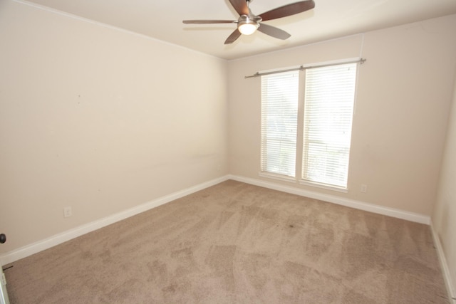 unfurnished room with light carpet and ceiling fan