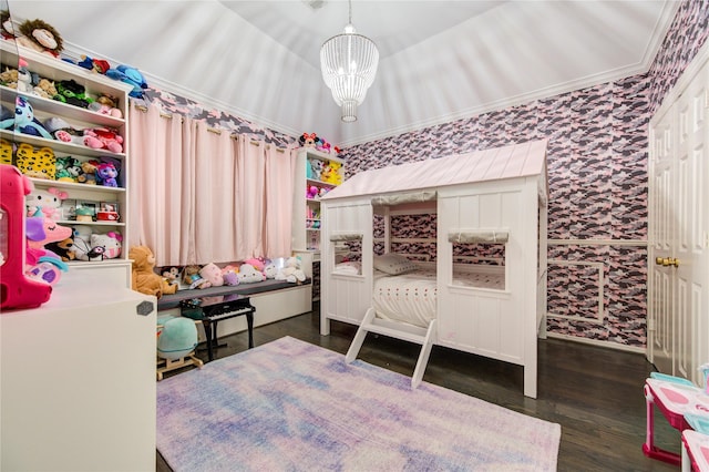 bedroom featuring dark wood-type flooring, crown molding, and a notable chandelier