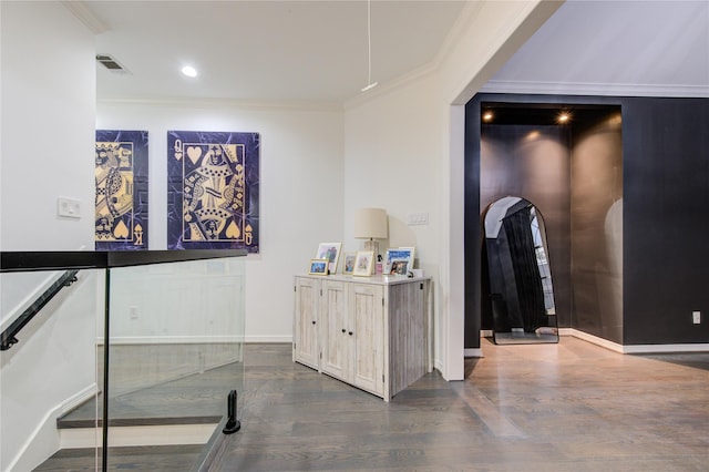 hallway featuring dark hardwood / wood-style floors and ornamental molding