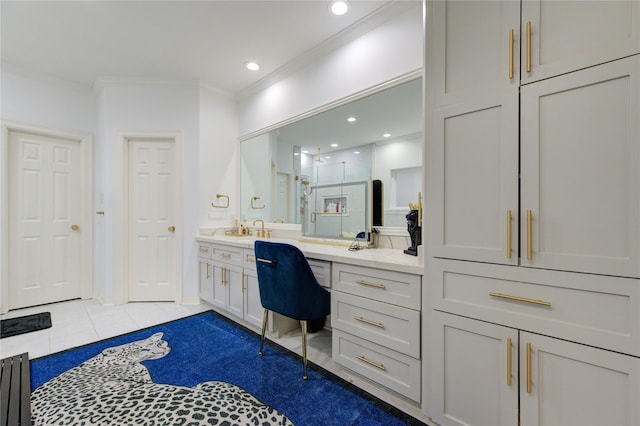 bathroom featuring crown molding, tile patterned flooring, vanity, and walk in shower