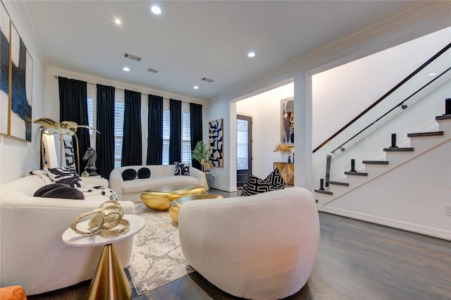 living room featuring dark hardwood / wood-style floors and crown molding