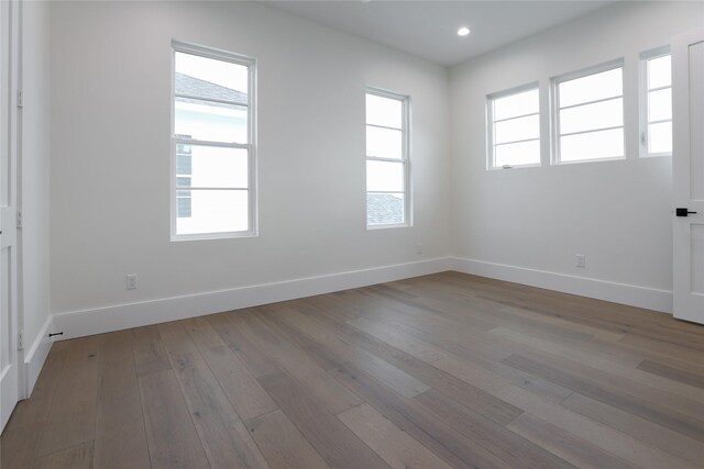 unfurnished room with light hardwood / wood-style flooring