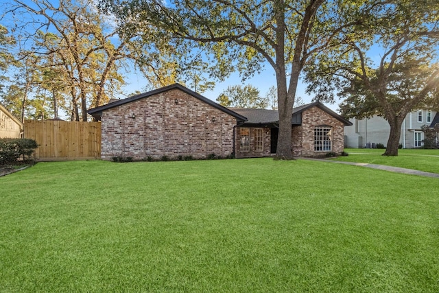 ranch-style house with a front yard