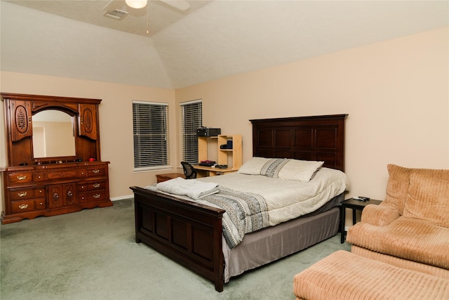 carpeted bedroom with lofted ceiling and ceiling fan