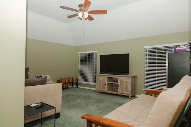 living room featuring light carpet, ceiling fan, and vaulted ceiling