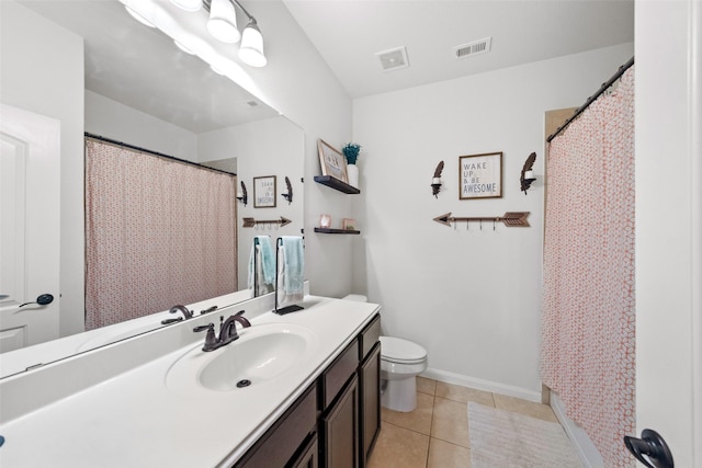 bathroom with walk in shower, tile patterned flooring, vanity, and toilet