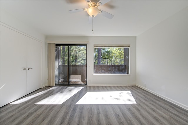 spare room featuring hardwood / wood-style floors and ceiling fan