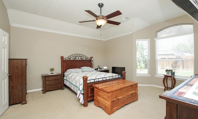 carpeted bedroom featuring ceiling fan and ornamental molding