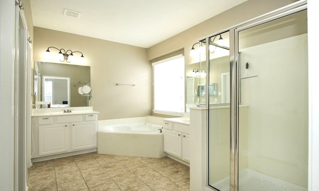 bathroom with vanity and independent shower and bath