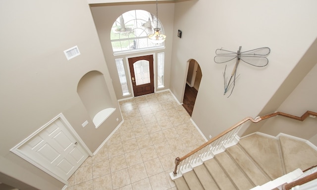 foyer with a towering ceiling