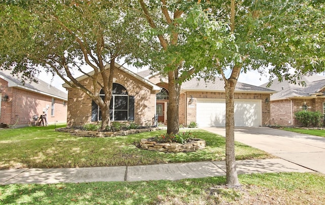 view of front facade with a garage and a front lawn