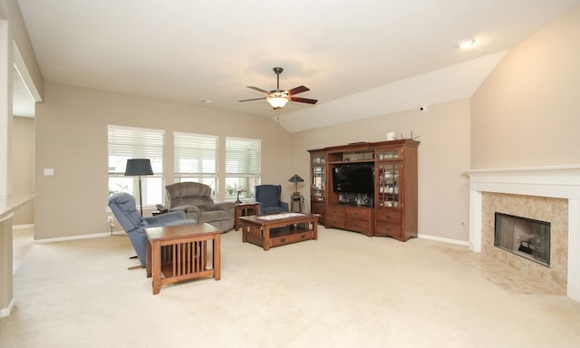 living room with light carpet, a fireplace, ceiling fan, and lofted ceiling