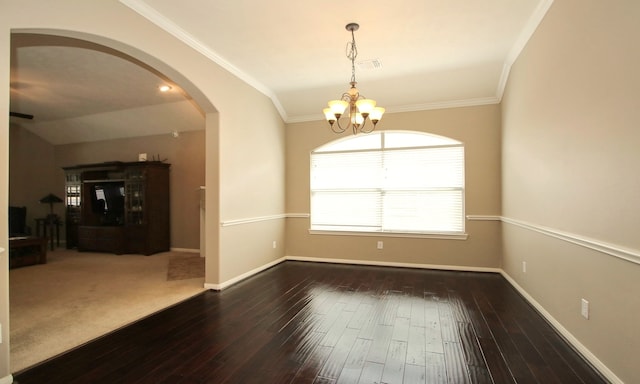 spare room featuring crown molding, dark hardwood / wood-style flooring, lofted ceiling, and a notable chandelier