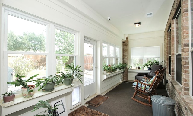 sunroom / solarium featuring a wealth of natural light