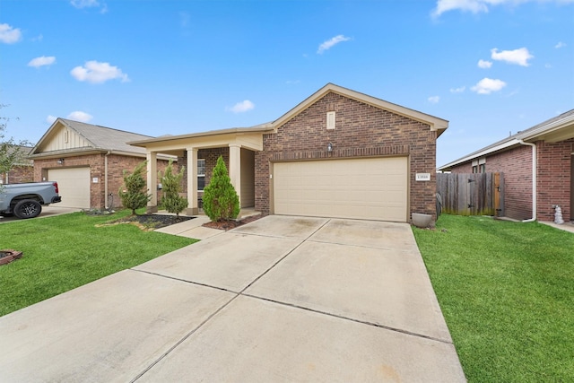 view of front of house featuring a garage and a front lawn