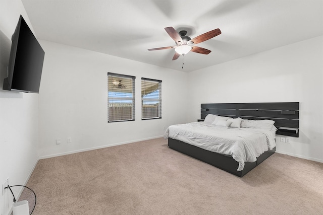 bedroom featuring ceiling fan and light carpet