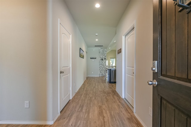 hall with light hardwood / wood-style flooring