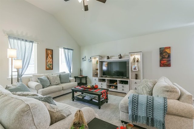 living room featuring hardwood / wood-style flooring, ceiling fan, and lofted ceiling