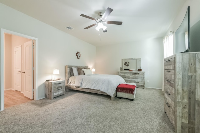 bedroom with light colored carpet and ceiling fan