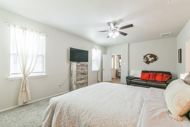 bedroom with light carpet and ceiling fan