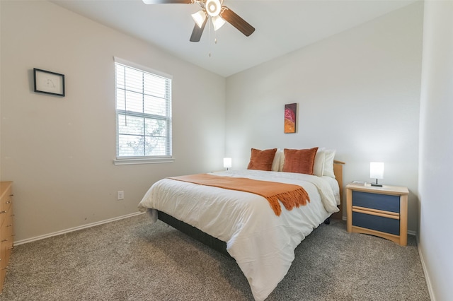 bedroom featuring ceiling fan and carpet