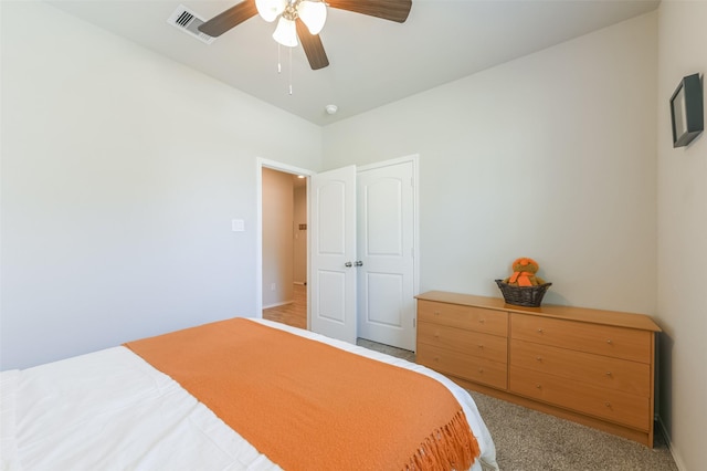 carpeted bedroom with ceiling fan