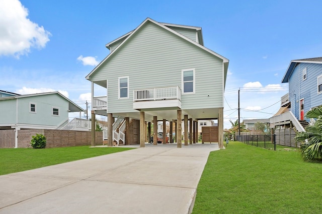 back of property featuring a yard and a carport