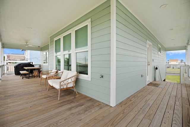 deck with a porch and grilling area