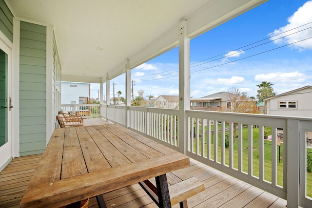 wooden deck with a yard