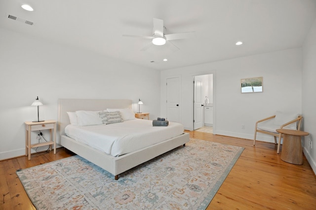 bedroom with wood-type flooring and ceiling fan