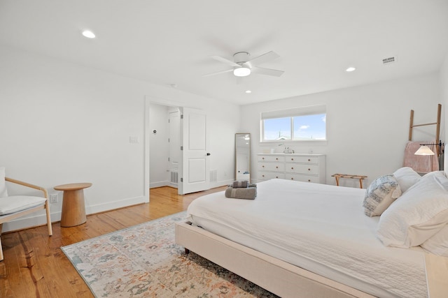 bedroom with light wood-type flooring and ceiling fan