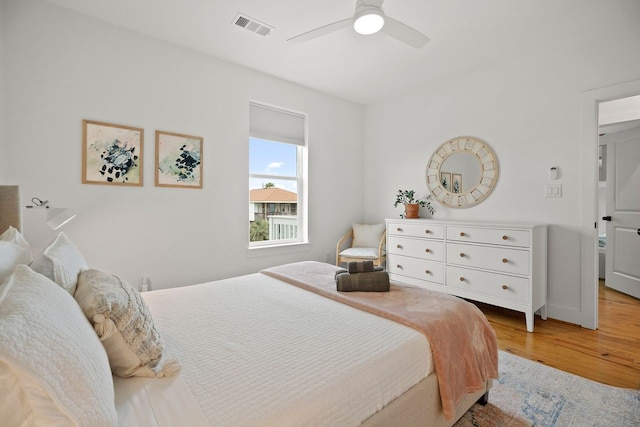 bedroom with ceiling fan and light wood-type flooring