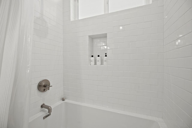 bathroom with shower / tub combo