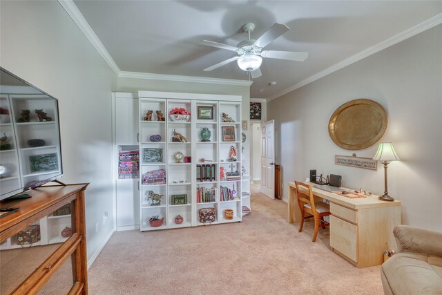 home office featuring light carpet, ceiling fan, and ornamental molding